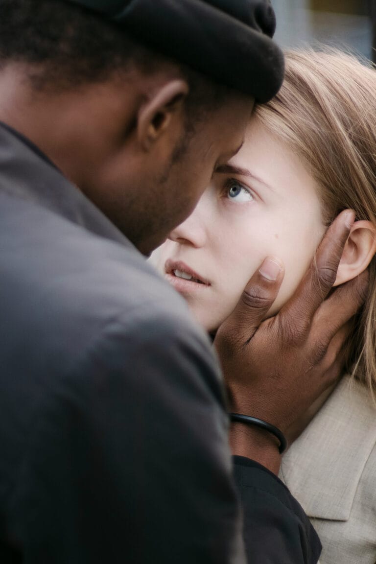 Intimate engagement portrait of a couple sharing a close emotional moment