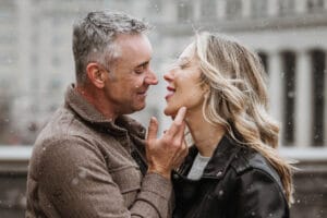 Romantic winter engagement portrait of a couple during a snowy day in Ottawa