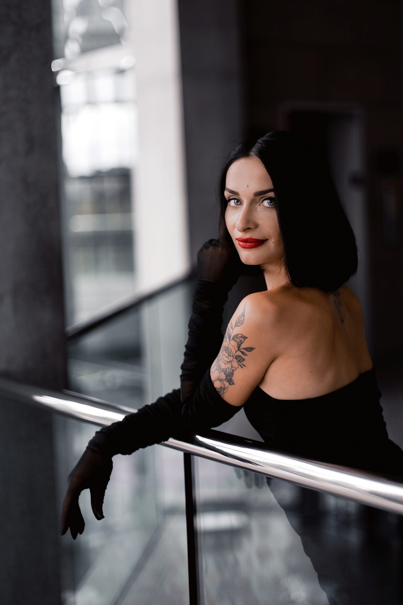 Elegant lifestyle personal branding portrait of a woman in an urban interior
